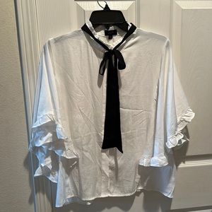 White blouse with black scarf/tie